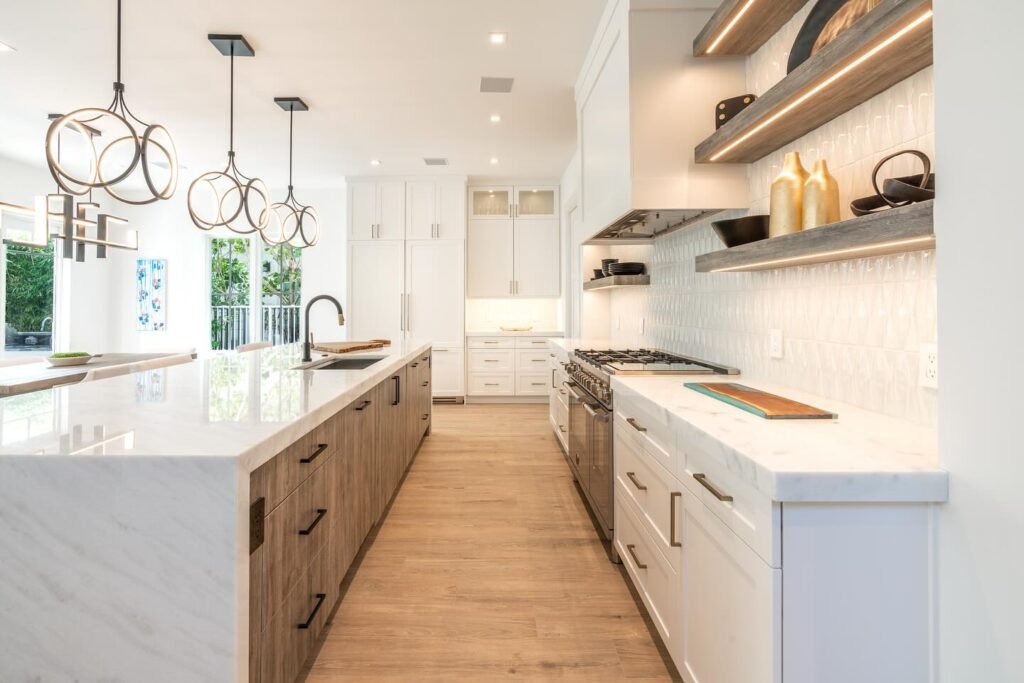 Organized corner pantry with floating rustic wood shelves stocked with spices and bottles, white shaker cabinets, textured backsplash, and quartz countertop in kitchen remodel Salt Lake City